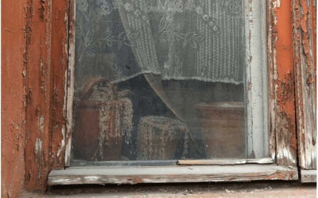 the window of an empty apartment in riga latvia august 2012